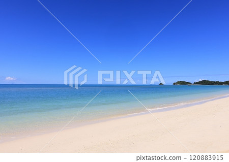 Nature Landscape Autumn in Yanbaru, a calm beach. Izena Island can be seen small on the horizon on the left. Nature Landscape Autumn in Yanbaru, a calm beach. Izena Island can be seen small on the horizon on the left. 120883915
