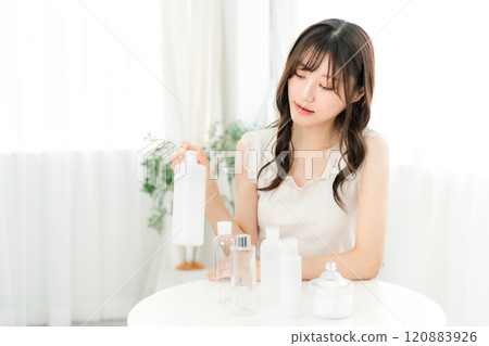 Young Asian woman doing skin care with basic skincare products and cosmetics 120883926