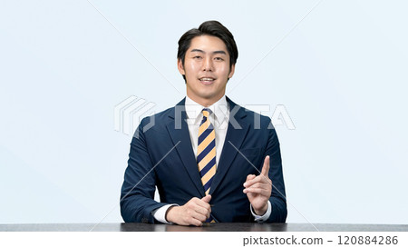 A male business person explaining while looking at the camera A male business person explaining while looking at the camera 120884286