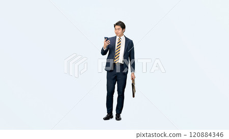 Full-body photo of a male business person looking at his smartphone while walking 120884346