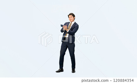 Full-body photo of a male business person dancing while using a smartphone Full-body photo of a male business person dancing while using a smartphone 120884354