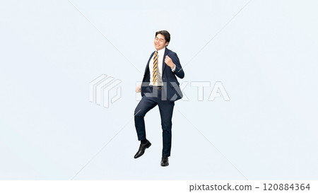 Full-body photo of a male business person dancing happily 120884364