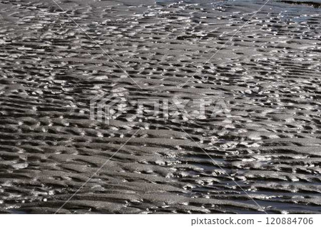 Ripples on the beach reflected in the shadows of light Ripples on the beach reflected in the shadows of light 120884706