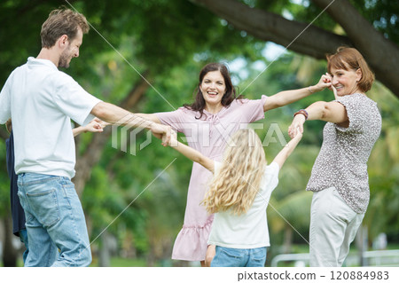 Caucasian family parent and their children picnic at the park in morning. Caucasian family parent and their children picnic at the park in morning. 120884983