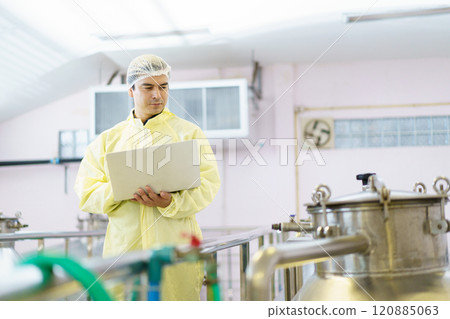 Senior quality control officer performs the inspection and analyzing of boiler tank inside the food and beverage manufacturing factory. The supervisor inspects boiler tank. Senior quality control officer performs the inspection and analyzing of boiler tank inside the food and beverage manufacturing factory. The supervisor inspects boiler tank. 120885063