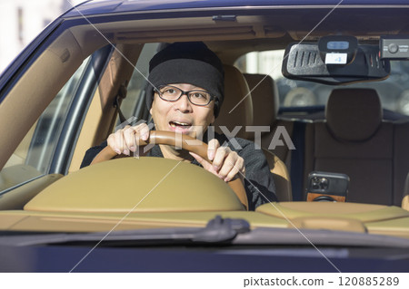 Image of a man surprised while driving 120885289