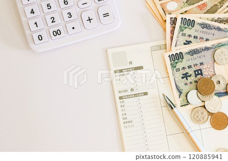 Household account book, banknotes and calculator - Money management and budgeting Household account book, banknotes and calculator - Money management and budgeting 120885941