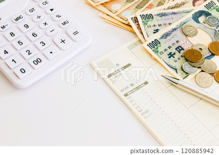 Household account book, banknotes and calculator - Money management and budgeting Household account book, banknotes and calculator - Money management and budgeting 120885942