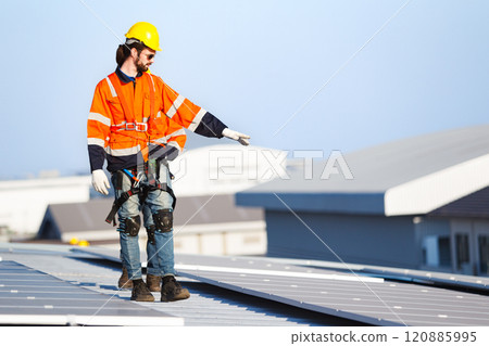 Professional electric engineers survey and inspect solar panels installation on the factory metal sheet roof top, electric engineer team inspecting and check solar cell system. Professional electric engineers survey and inspect solar panels installation on the factory metal sheet roof top, electric engineer team inspecting and check solar cell system. 120885995