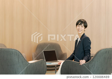 Woman working in coworking space 120886489