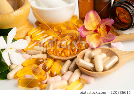 Alternative medicine herbal organic capsule with vitamin E omega 3 fish oil, mineral, drug with herbs leaf natural supplements for healthy good life. Alternative medicine herbal organic capsule with vitamin E omega 3 fish oil, mineral, drug with herbs leaf natural supplements for healthy good life. 120886615