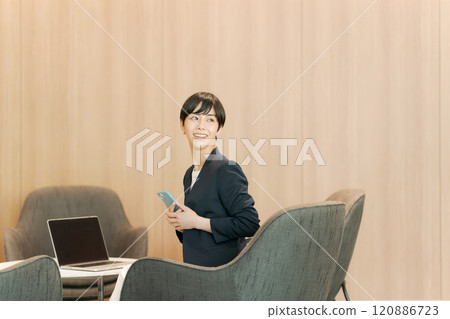 Woman working in coworking space 120886723