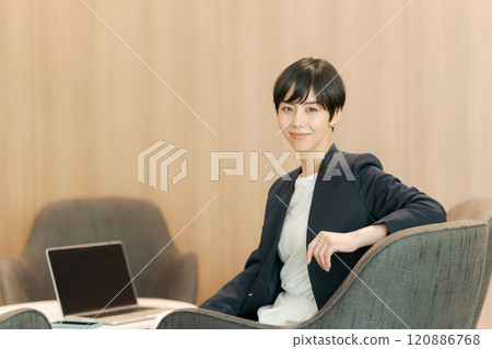 Woman working in coworking space Woman working in coworking space 120886768