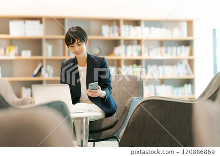 Woman working in coworking space 120886869