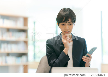 Woman working in coworking space Woman working in coworking space 120886871