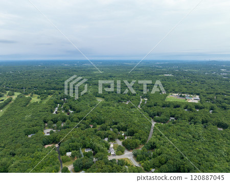 Aerial view of Suburban neighborhood Norfolk County, Massachusetts with green forest, with big villa 120887045