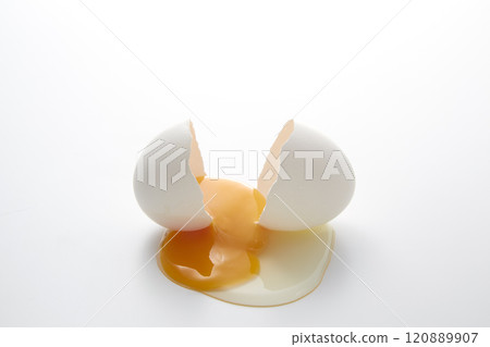 Cracked chicken egg on a white background 120889907