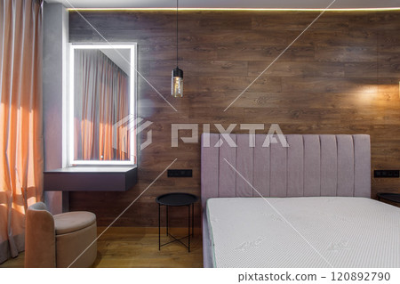 large modern bedroom bed with headboard warm wooden laminate on wall 120892790