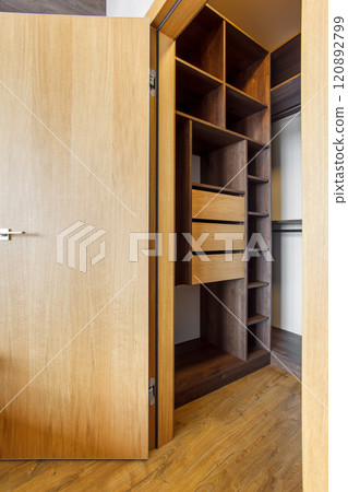 compact built-in wardrobe in the master bedroom 120892799