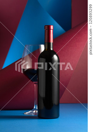 Bottle and glass of red wine. Bottle and glass of red wine. 120893299