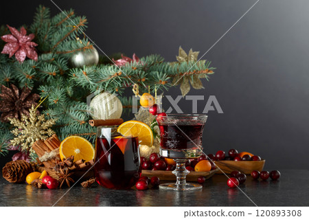 Christmas drinks with ingredients on a background of Christmas tree. Christmas drinks with ingredients on a background of Christmas tree. 120893308