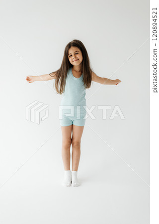Funny girl 5 years posing at studio. Girl have fun on white background 120894521