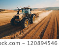 Cultivation of the field by tractors after harvesting. 120894546