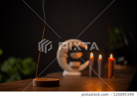 Incense sticks smoldering on table indoors, space for text Incense sticks smoldering on table indoors, space for text 120895399