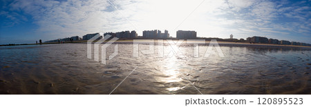 Panoramic View of Sandy Beach With Urban Skyline and Sunny Sky Panoramic View of Sandy Beach With Urban Skyline and Sunny Sky 120895523