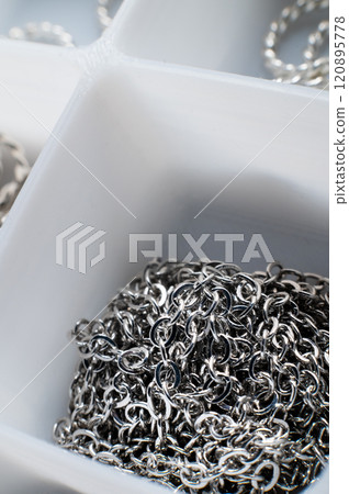 box with jump rings made of jewelry materials for making crafts close up 120895778