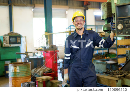Smart and good looking senior factory or mechanical engineer standing in the factory portrait, caucasian white male engineer or foreman portrait in factory. 120896210