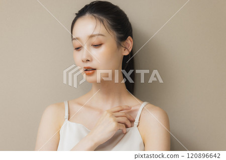 Woman smiling with hands on face 120896642