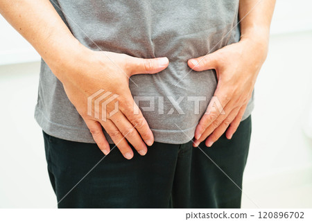 Hernia, Asian man stomach ache, abdominal pain and urology problem health. 120896702