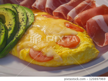 Breakfast plate with omelette and bacon with avocado slices.Macro.AI Generative. 120897969