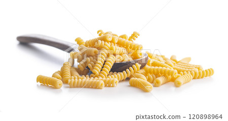 Uncooked italian pasta. Fusilli pasta on spoon isolated on white background. 120898964