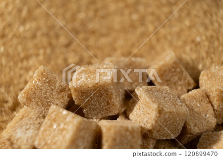 Brown cane unrefined demerara sugar in the form of crystals and cubes Brown cane unrefined demerara sugar in the form of crystals and cubes 120899470