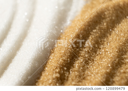 Two types of crystalline sugar are white refined beet sugar and brown unrefined cane sugar. Two types of crystalline sugar are white refined beet sugar and brown unrefined cane sugar. 120899479