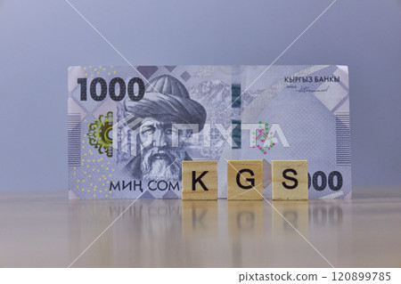 Inscription KGS on wooden blocks with one thousand Kyrgyz som Inscription KGS on wooden blocks with one thousand Kyrgyz som 120899785