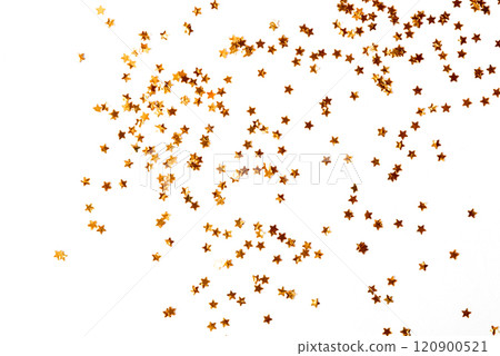 Festive golden stars of confetti on a white background. 120900521