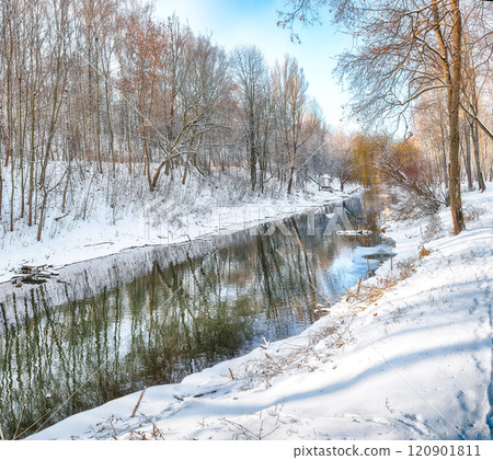 Fantastic  landscape in city park with snowy trees and beautiful frozen river. 120901811