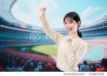 Young woman cheering at the stadium Young woman cheering at the stadium 120901888