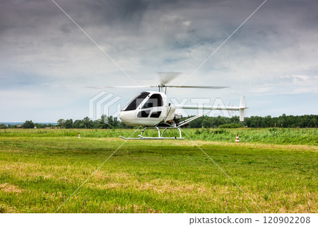 Landing a small helicopter in the field Landing a small helicopter in the field 120902208