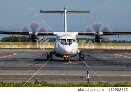 Taxiing turboprop airplane from the runway 120902285