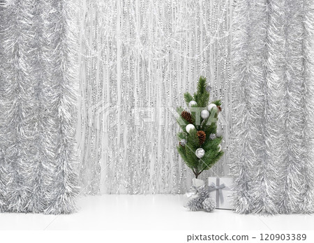Empty tabletop with Christmas tree on shiny silver background. New Year greeting card with copy space. 120903389
