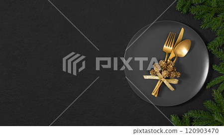Black table setting with gold cutlery and fir branches. Christmas dinner. Banner. View from above. Space for text. 120903470