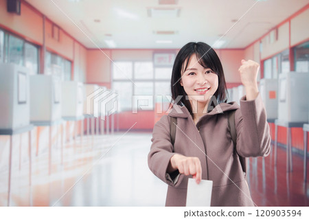 女選民在投票所的選舉中投票 女選民在投票所的選舉中投票 120903594