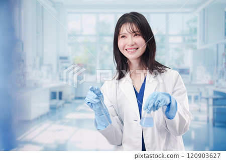 A female researcher conducting research in a laboratory A female researcher conducting research in a laboratory 120903627
