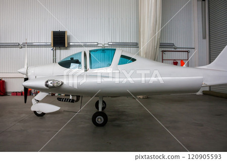 Small sports airplane in the hangar 120905593