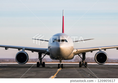 Wide-bodied passenger aircraft on the main taxiway Wide-bodied passenger aircraft on the main taxiway 120905617