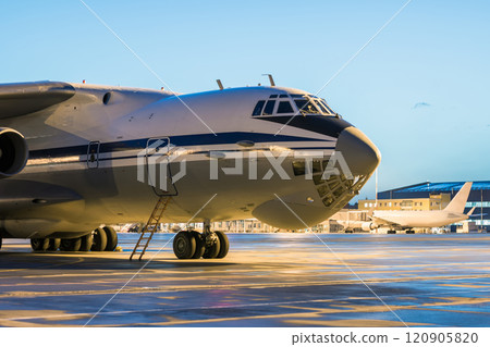 Close-up big cargo airplane at the airport apron in the early morning Close-up big cargo airplane at the airport apron in the early morning 120905820